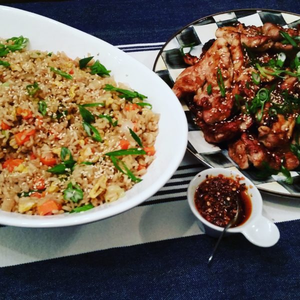Fried rice and a plate of chicken satay with peanut sauce