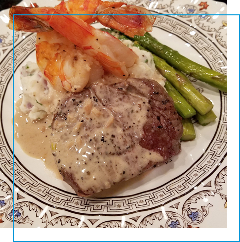 Steak and shrimp surf and turf dinner with asparagus